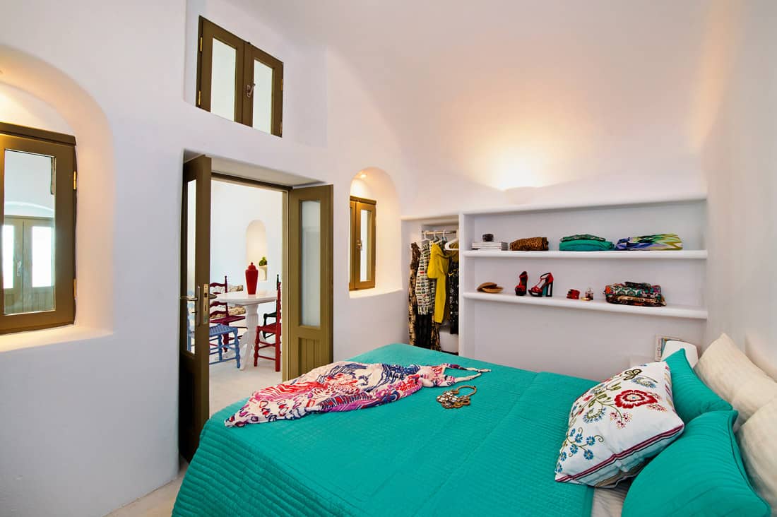 Bedroom with open wardrobe