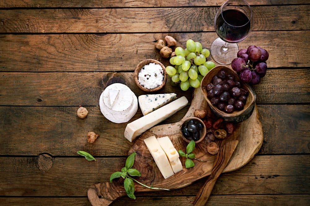 Wine, cheese, and grapes