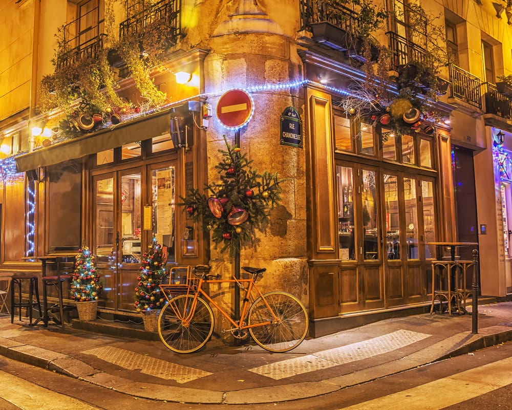 Cafe decorated with Christmas lights in Paris