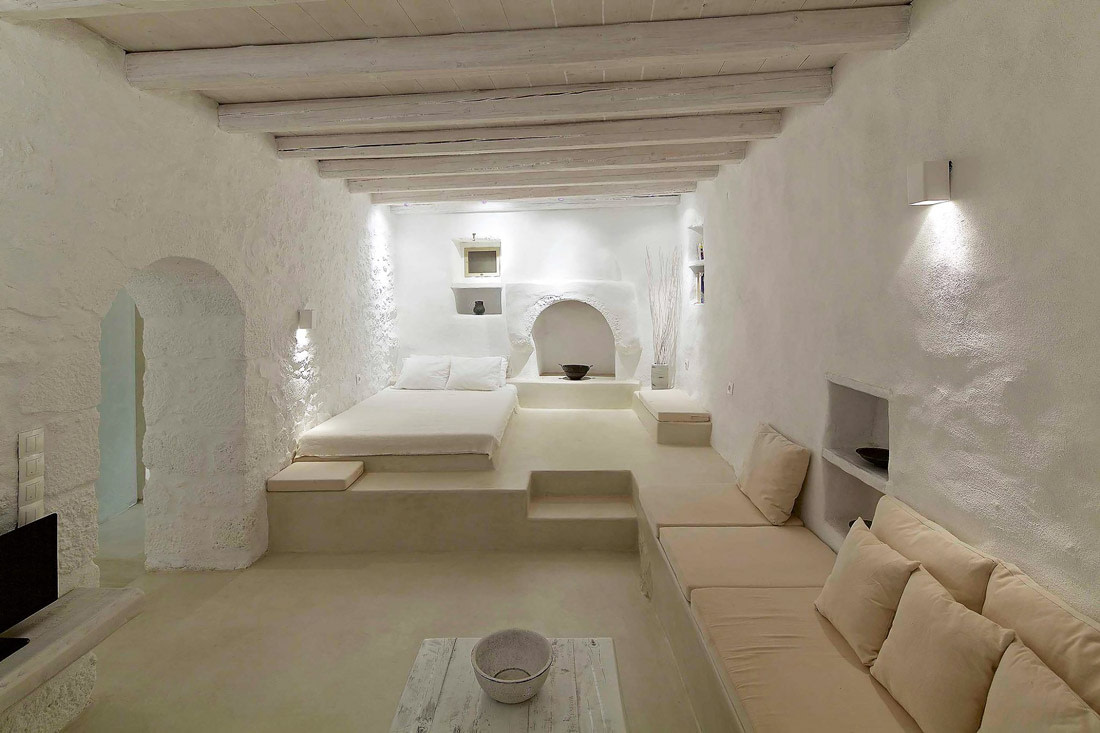 White bedroom with exposed beams