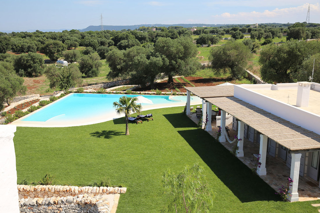 Swimming pool with undulating beach slopes