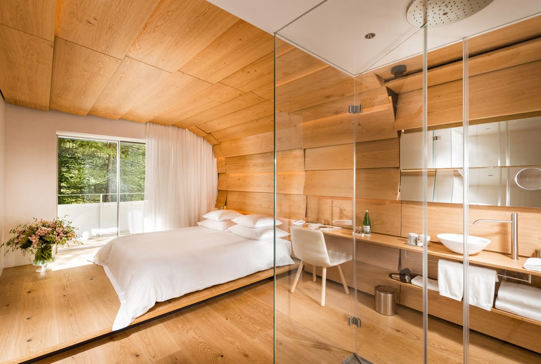 Bedroom decked out in blonde Swiss oak panels
