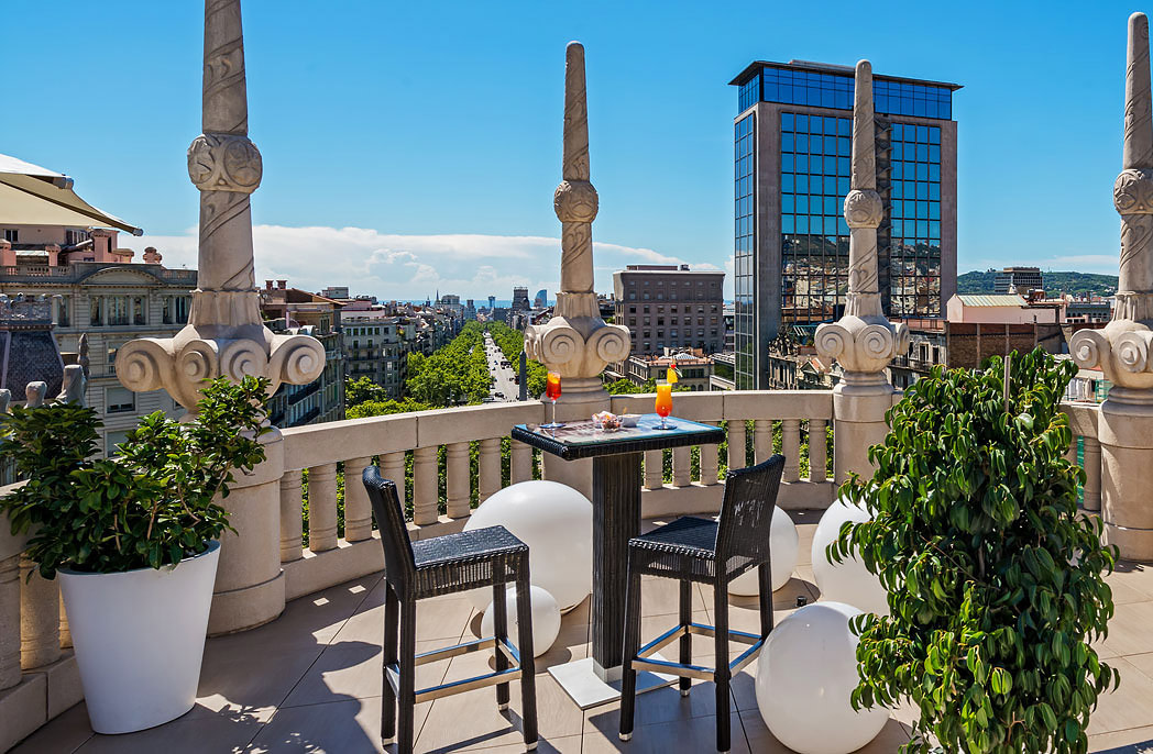 Modernist rooftop deck with city views